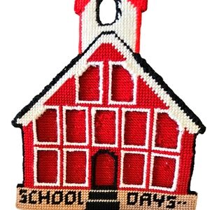 Hand needlepoint schoolhouse frame for kid's photos.